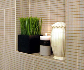 Decorative ledges here transform the small bathroom into a spa